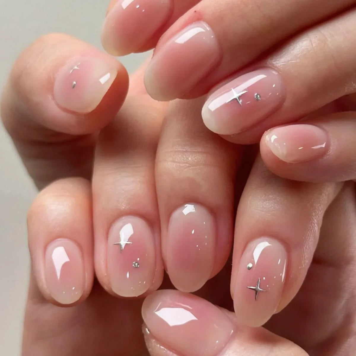 24Pcs Short Oval Head Blush Pink Press on Nails with Simple Designs Almond Nails Wearable Acrylic Full Cover Nail Tips with Glue 25